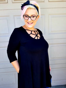 Not your basic tunic top in black